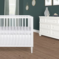 632-WHT Lucas Mini Modern Crib With Rounded Spindles Room Shot 01