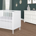 632-WHT Lucas Mini Modern Crib With Rounded Spindles Room Shot 02