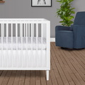632-WHT Lucas Mini Modern Crib With Rounded Spindles Room Shot 04