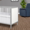 632-PGW Lucas Mini Modern Crib With Rounded Spindles Room Shot 03