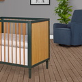 632-OLV Lucas Mini Modern Crib With Rounded Spindles Room Shot 03